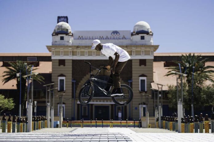 Courage Adams performs a 180 Barspin during the filming of 