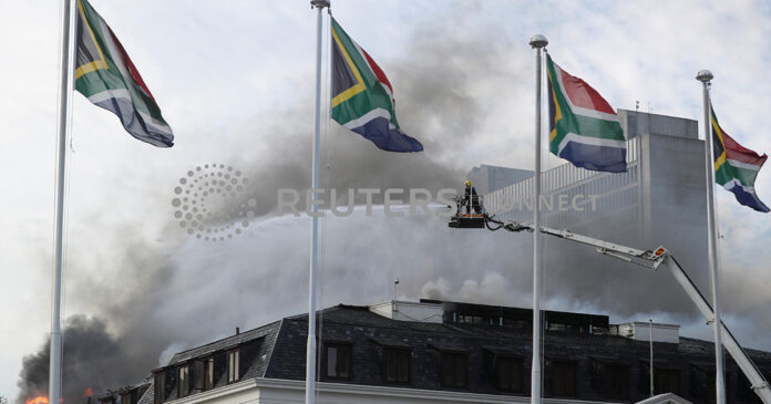 Parliament-Fire-2 Firefighters work at the national parliament as the fire flared up again, in Cape Town, South Africa, January 3, 2022. REUTERS/Mike Hutchings