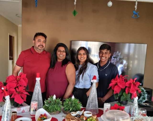 Pictured above: Nikhil with his family.