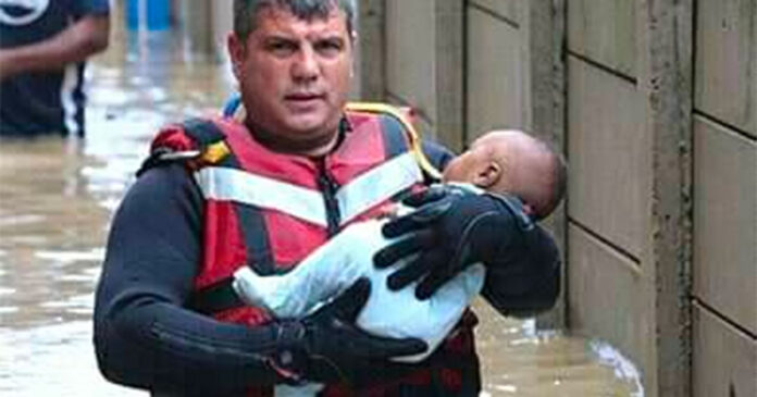 police-hero-ladysmith-saving-baby Heroes Emerge as Floods Lead to Rescues and Evacuations in Ladysmith