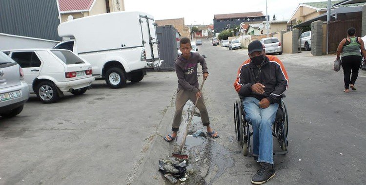 John Martin and Shiloh Felix go out together to collect rubbish in their street in Gqeberha. Photo: Joseph Chirume