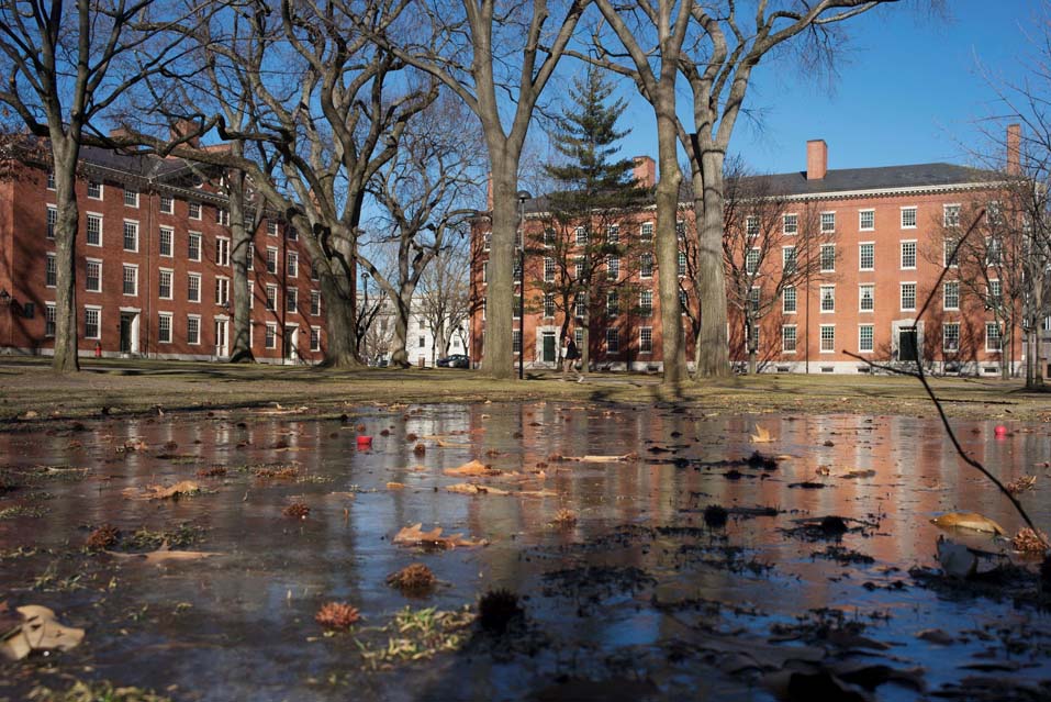 John Comaroff Harvard law suitFILE PHOTO: Buildings in Harvard Yard are reflected in frozen puddle at Harvard University in Cambridge, Massachusetts January 20, 2015. REUTERS/Brian Snyder//File Photo