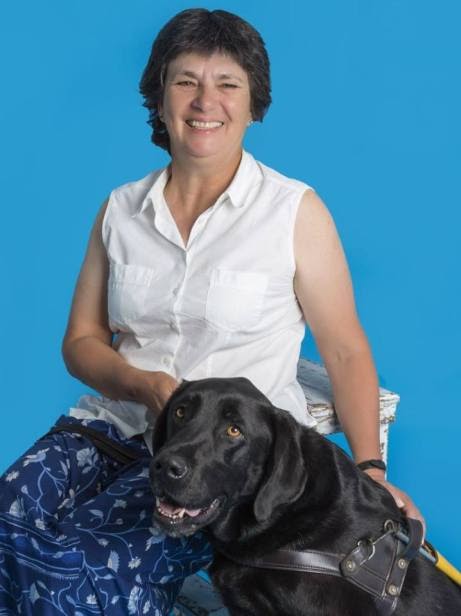 Pictured above: Jenny with her guide dog, Kaine