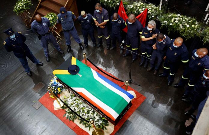 Colleagues gather around the coffin of police diver Sergeant Busisiwe Mjwara who died while searching for flood victims, at her official funeral in Pietermaritzburg Colleagues gather around the coffin of police diver Sergeant Busisiwe Mjwara who died while searching for flood victims, at her official funeral in Pietermaritzburg