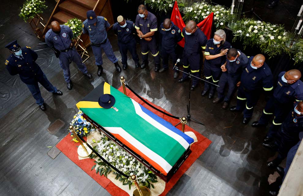 Colleagues gather around the coffin of police diver Sergeant Busisiwe Mjwara who died while searching for flood victims, at her official funeral in Pietermaritzburg