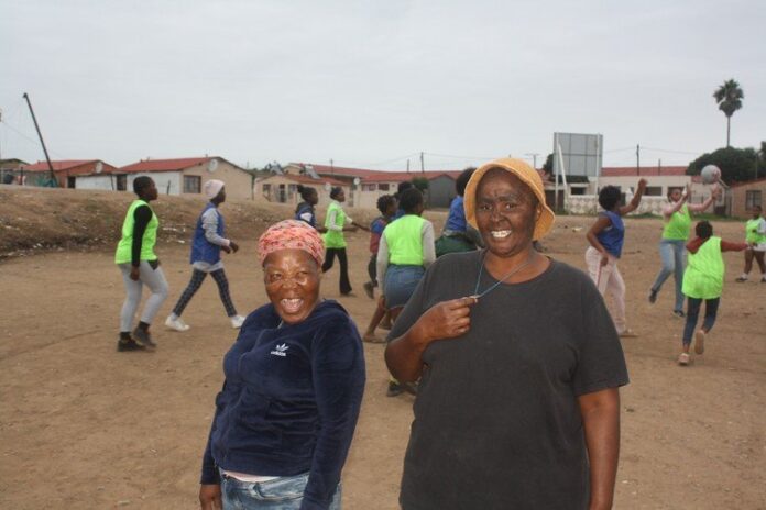 Ntomboxolo Twalingca (left) and Mandisa Ncamiso (right) spent a month cleaning piles of rubbish from this field in KwaNobuhle township in Kariega so they could start a netball club for teenage girls from the community. Photo: Thamsanqa Mbovane Ntomboxolo Twalingca (left) and Mandisa Ncamiso (right) spent a month cleaning piles of rubbish from this field in KwaNobuhle township in Kariega so they could start a netball club for teenage girls from the community. Photo: Thamsanqa Mbovane