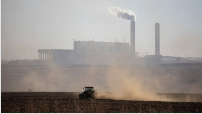 A farmer works with his tractor in front of the Kusile Power Station located in eMalahleni. In Gauteng province residents can sometimes smell the pollution coming from this direction. Wikus de Wet/AFP via Getty Images A farmer works with his tractor in front of the Kusile Power Station located in eMalahleni. In Gauteng province residents can sometimes smell the pollution coming from this direction. Wikus de Wet/AFP via Getty Images