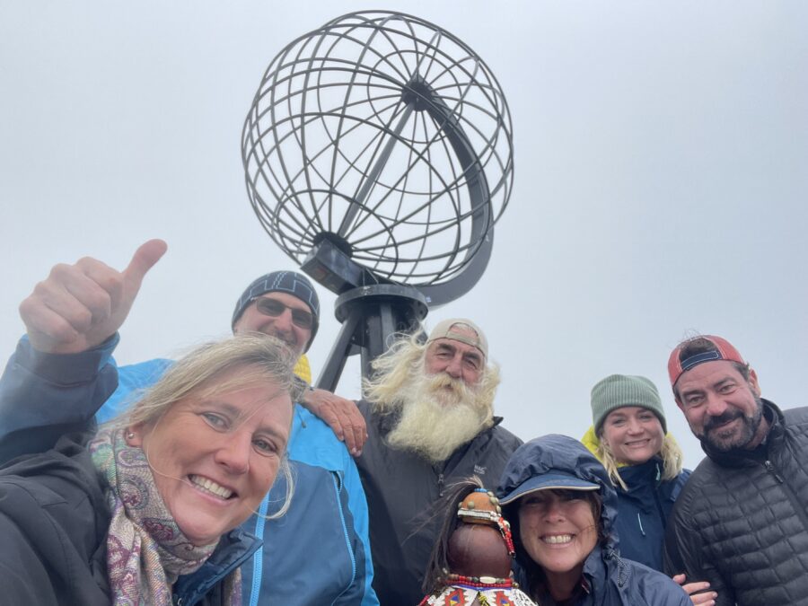 The Defender Transcontinental Expedition team at Nordkapp's Globe monument at the northernmost point in Norway. L to R: Fiona Nixon, Shova Mike Nixon, Kingsley Holgate, Sheelagh Antrobus, Anna Holgate, Ross Holgate
