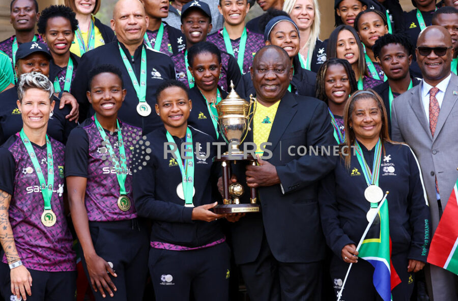 South African women's soccer team players pose for a photograph next to President Cyril Ramaphosa as they celebrate after winning their first Women's Africa Cup of Nations title in Morocco, at the at the government's union building in Pretoria, South Africa, July 27, 2022. REUTERS/Siphiwe Sibeko