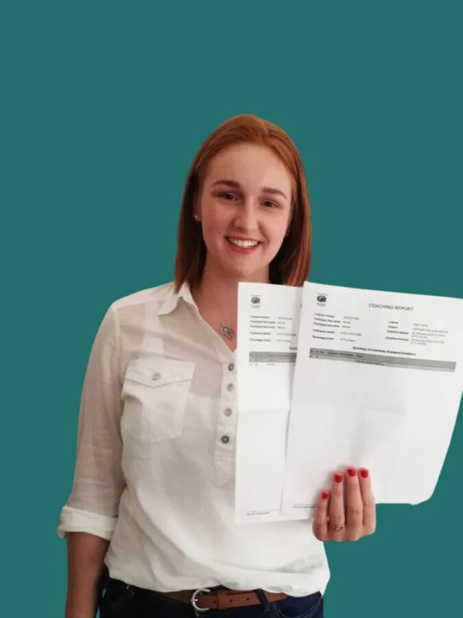 Nicole showing off her certificates which she received for passing her written exams as part of her air pilot training.