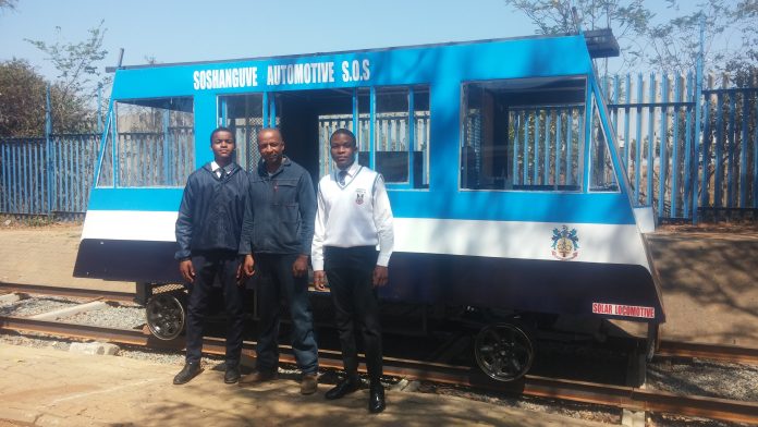Learner Mpho Bongwe, mentor Kgomotso Maimane and learner Lethabo Nkadimeng (from left to right) of the Soshanguve Technical School of Specialisation show off their newly built solar train. Photos: Chris Gilili