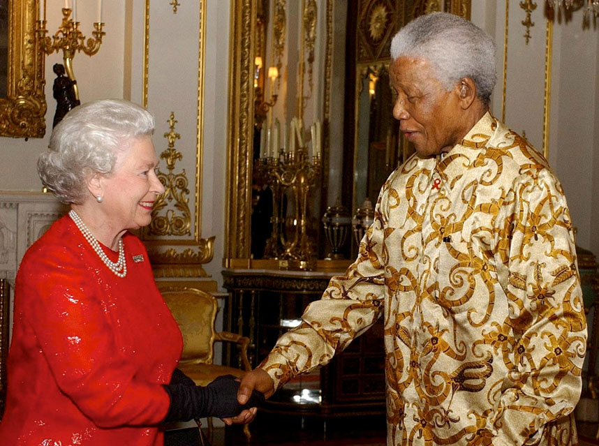 FILE PHOTO: Britain's Queen Elizabeth II (L) greets former South African President Nelson Mandela during a reception at Buckingham Palace, London, October 20, 2003, to mark the centenary of the Rhodes Trust. REUTERS/POOL/Kirsty Wigglesworth