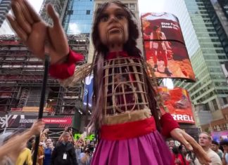 Giant refugee puppet 'Little Amal' welcomes 'the huddled masses' in New York City's Times Square