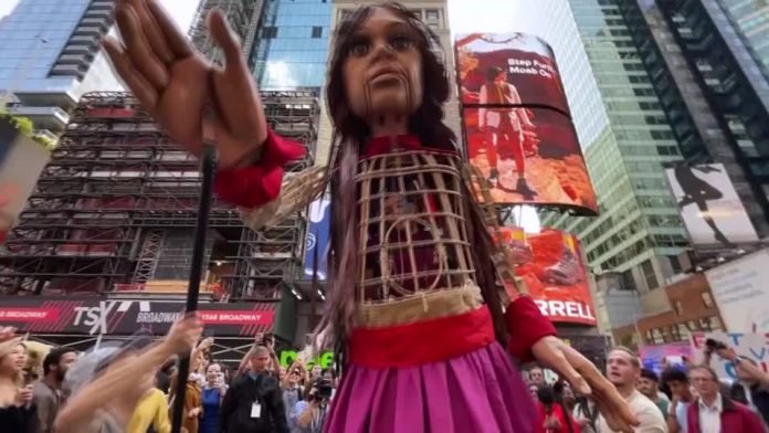 Giant refugee puppet 'Little Amal' welcomes 'the huddled masses' in New York City's Times Square Giant refugee puppet 'Little Amal' welcomes 'the huddled masses' in New York City's Times Square