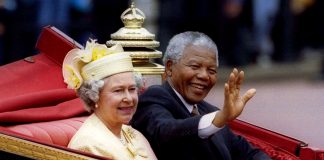 FILE PHOTO: South African President Nelson Mandela is accompanied by Britain's Queen Elizabeth II in a carriage ride to a Buckingham Palace lunch during his state visit, in London, Britain July 9, 1996. REUTERS/Simon Kreitem