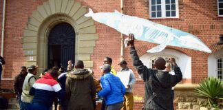 Supporters of the applicants, which included Sustaining the Wild Coast, local community members and Greenpeace, celebrate the outcome of the case outside the Eastern Cape High Court in Makhanda. Photo: Lucas Nowicki