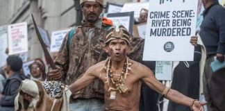 Chief Aùtshumao! Francisco MacKenzie (front) protests the Amazon headquarters development in Cape Town. Brenton Geach/Gallo Images via Getty Images
