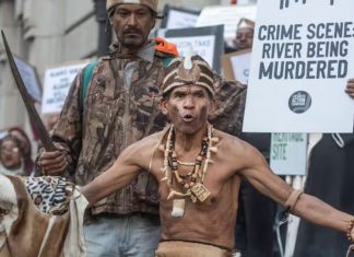 Chief Aùtshumao! Francisco MacKenzie (front) protests the Amazon headquarters development in Cape Town. Brenton Geach/Gallo Images via Getty Images