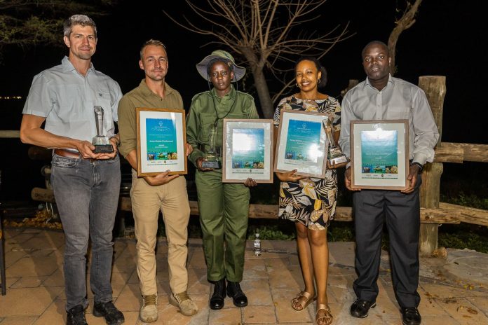 Left to Right John Jurko and Matt Lindenberg (representing Anton Mzimba), Dorcas Ntete (representing MWCT Simba Scouts), Faria Tarus (representing KWCA) and Amom Benoit IRF Africa Representative (representing Boris Harding NDOUROU) by Stew Nolan.jpg African Conservation Awards Announces Winners at African Ranger Congress