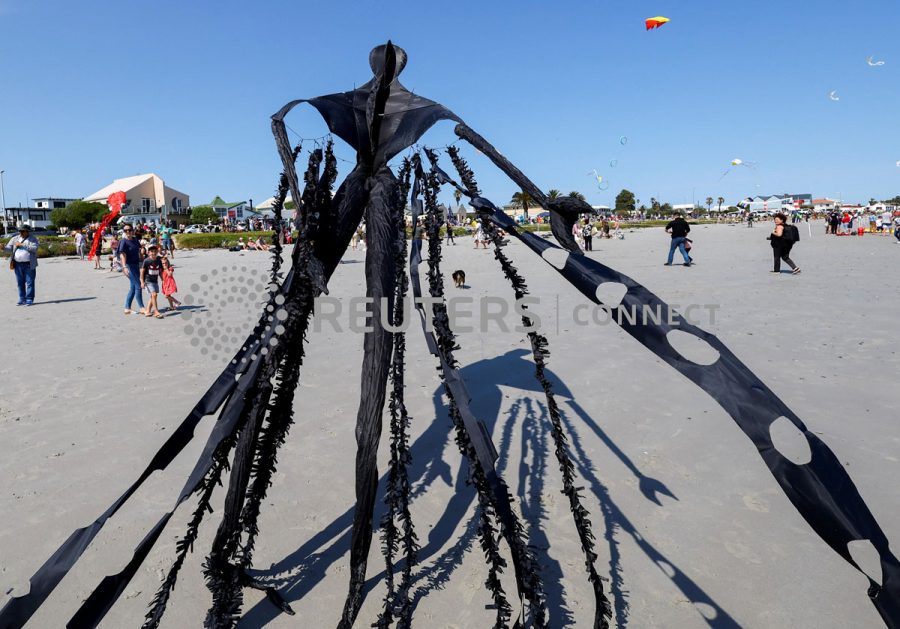 Kite enthusiasts fly their colourful kites during the Cape Town Kite Festival