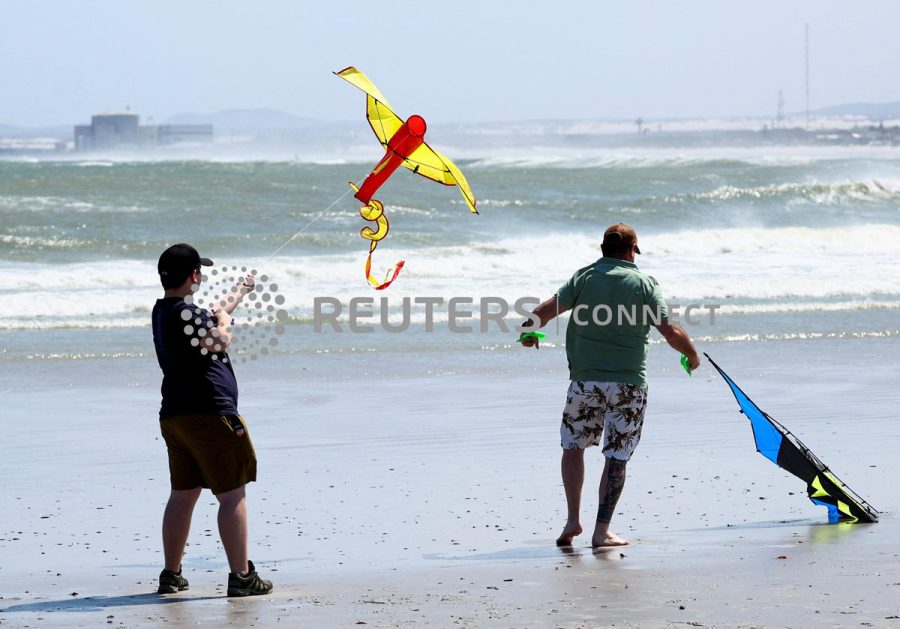 Kite enthusiasts fly their colourful kites during the Cape Town Kite Festival
