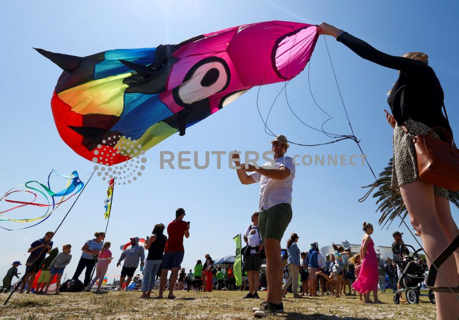 Kite enthusiasts fly their colourful kites during the Cape Town Kite Festival