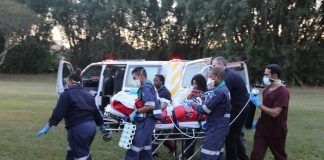 Paramedics for Netcare911 rescue are here seen rushing the critically injured 25-year-old tour guide who was attacked by a giraffe that killed her daughter to hospital.