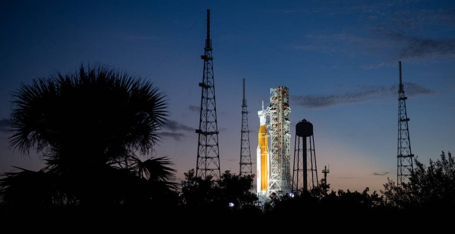 Artemis I Glows After SunsetDownload NASA’s Space Launch System (SLS) rocket with the Orion spacecraft aboard was seen lit by spotlights atop the mobile launcher at Launch Pad 39B as preparations for launch continued Sunday, Nov. 6, 2022, at NASA’s Kennedy Space Center in Florida.