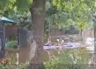 WATCH Residents Canoe Down Flooded Road in Potchefstroom, & Sports Field Looks Like Swimming Pool
