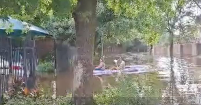 Potchefstroom-floods-canoe-paddling WATCH Residents Canoe Down Flooded Road in Potchefstroom, & Sports Field Looks Like Swimming Pool