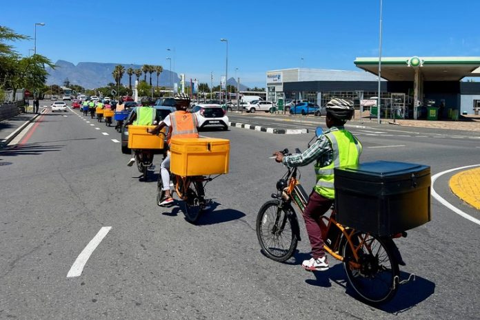 green riders delivery dunoon south africa Trainees ride in convoy near Bayside, Table View.