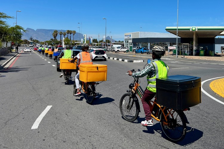 Trainees ride in convoy near Bayside, Table View.