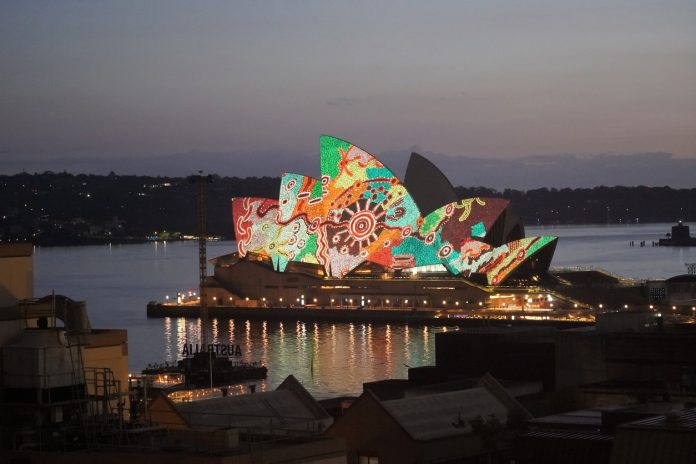 The Sails of the Sydney Opera House lit up with an Aboriginal Design Sydney, New South Wales, Australia, January 26, 2022. The design was projected onto the sails at dawn on Australia Day 2022