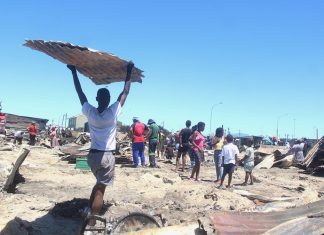 192 people were left homeless when 81 structures were destroyed in a fire in Town Two, Khayelitsha in Cape Town on Saturday morning. On Sunday, some people had begun rebuilding their homes. Photo: Masixole Feni