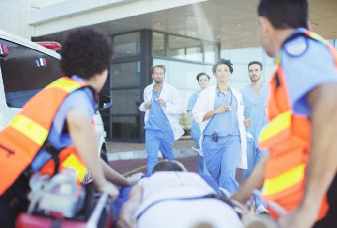 Doctors and nurses rushing to patient on ambulance stretcher Woman loses her life due to no available ambulance, and no money for private ambulance in Northern Cape