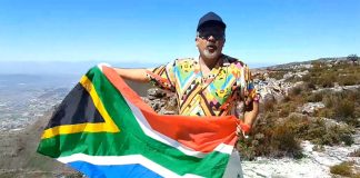 Faried Swartz on Table Mountain singing What the world (and South Africa) needs now