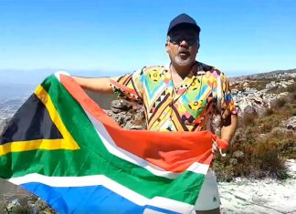 Faried Swartz on Table Mountain singing What the world (and South Africa) needs now