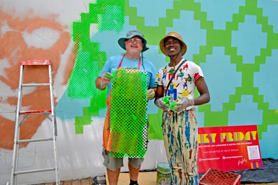 Lucky Friday and local artist Lutho Desmond Tutu Mural Hermanus