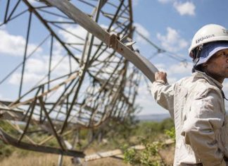 A worker leans on a collapsed pylon in Pretoria on April 12, 2023. Ageing infrastructure exacerbates the country’s energy supply crisis. Michele Spatari/AFP via Getty Images South Africa’s power outages could reach critical levels this winter