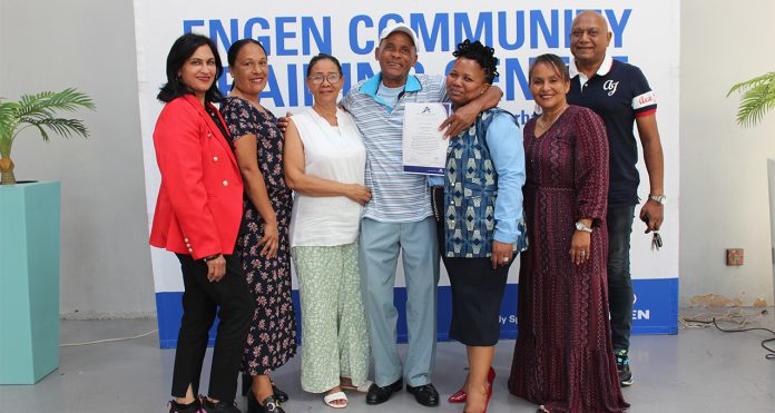 72-year-old-graduate-Joseph-Saunders-(in-the-centre)-with-Engen-and-JC--Community-Leaders Joseph Saunders