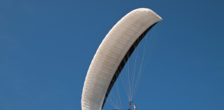 flying above the clouds paraglider