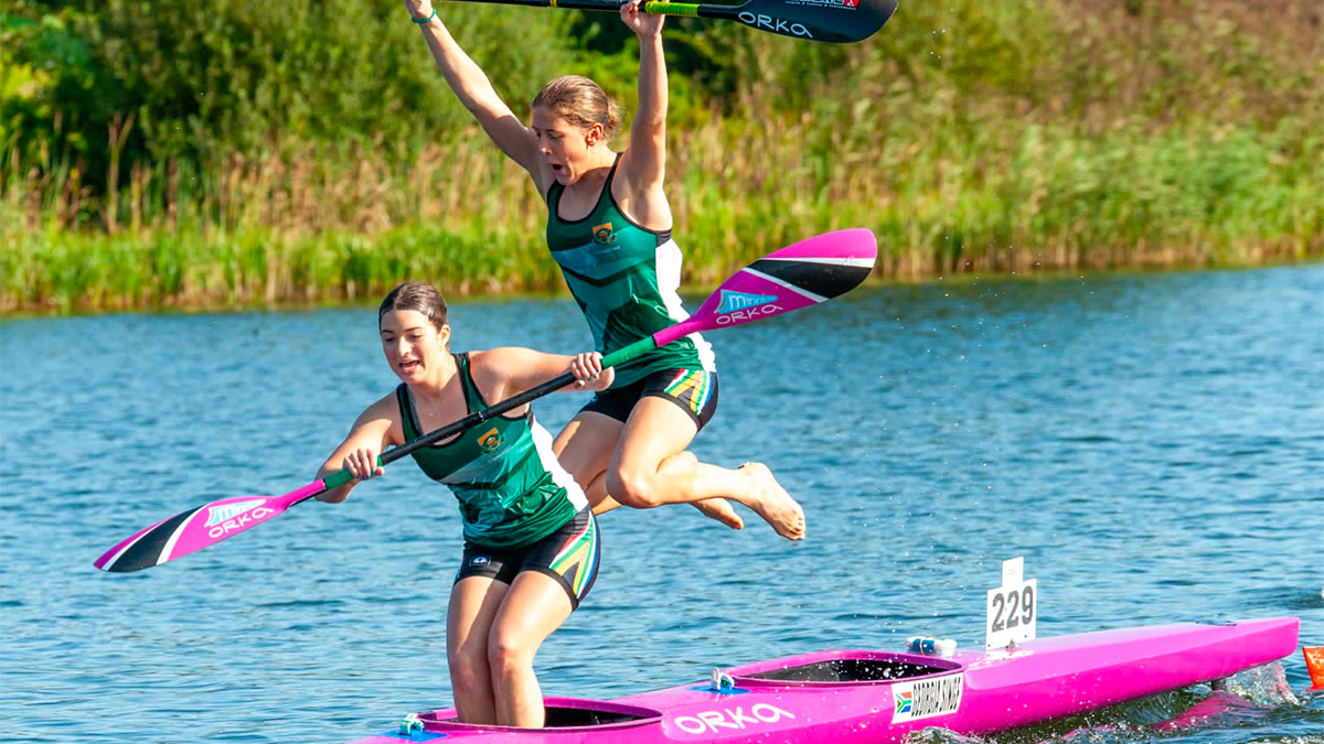 Holly Smith and Gergia Singe celebrate after winning the Junior K2 race at the ICF Canoe Marathon World Championships in Denmark on Friday.