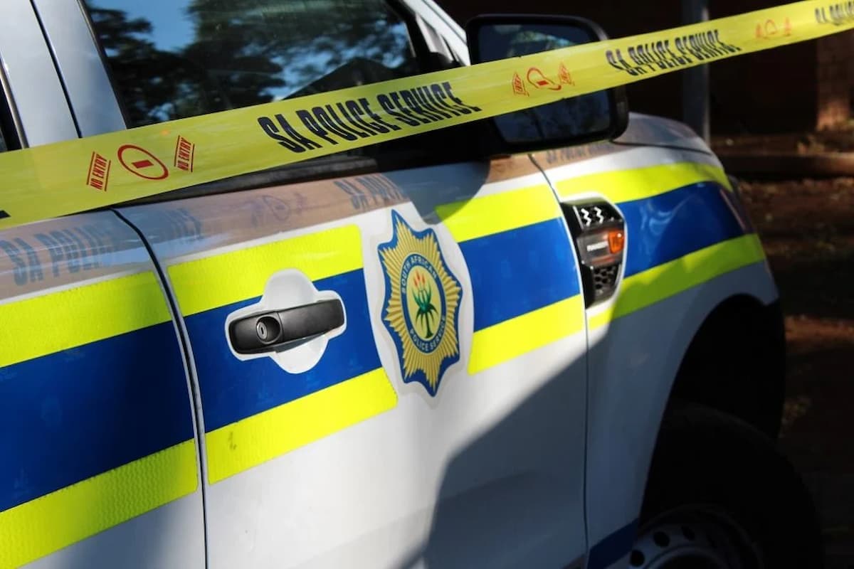 Image of an SAPS van and police tape. This image accompanies an article titled 'Cape Town area knocks Durban rival off the top of South Africa’s murder rankings'